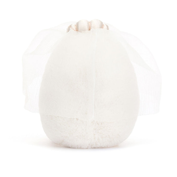 White spherical object with textured surface on white background