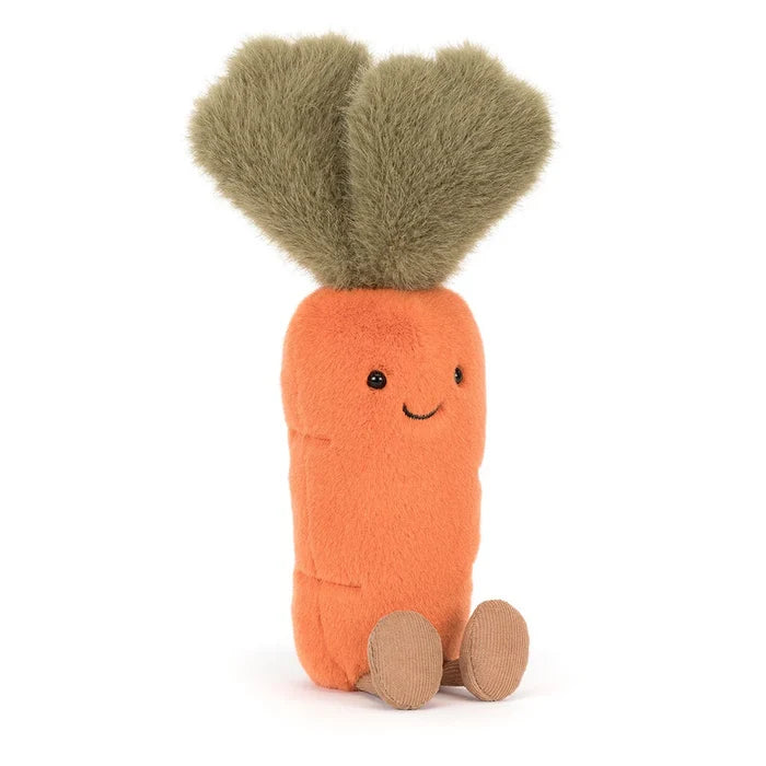 Stuffed toy carrot with a smiling face on a white background