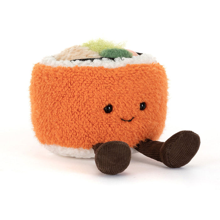 Plush toy resembling a roll of sushi with a smiling face on a white background