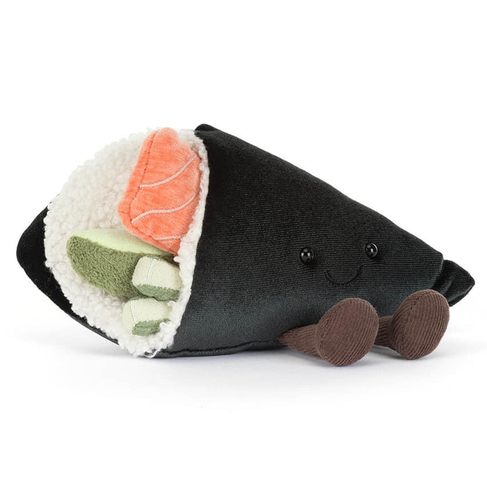 Stuffed toy resembling a sushi roll with black exterior, orange and green fillings on a white background
