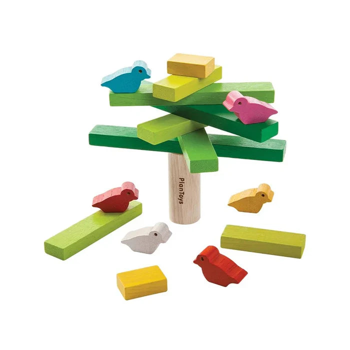 Colorful wooden toy set with birds and a tree on a white background