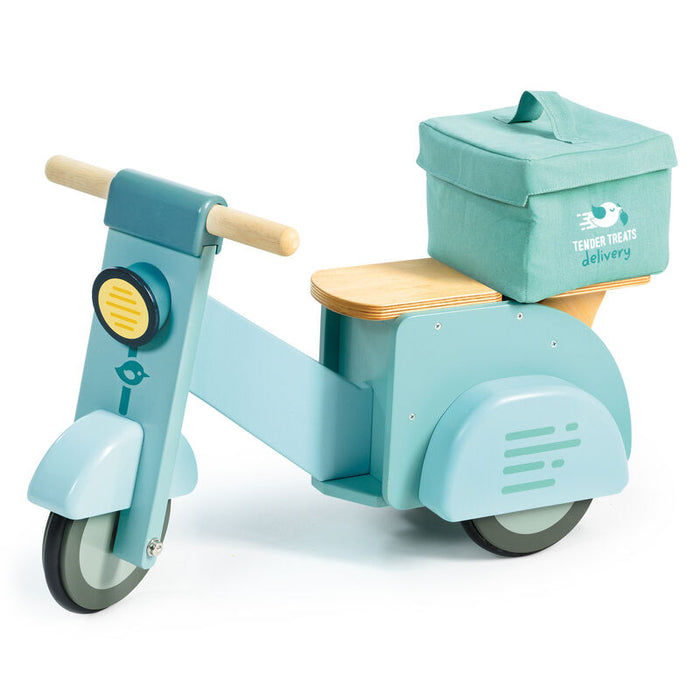 Blue wooden oy scooter with a box on a white background