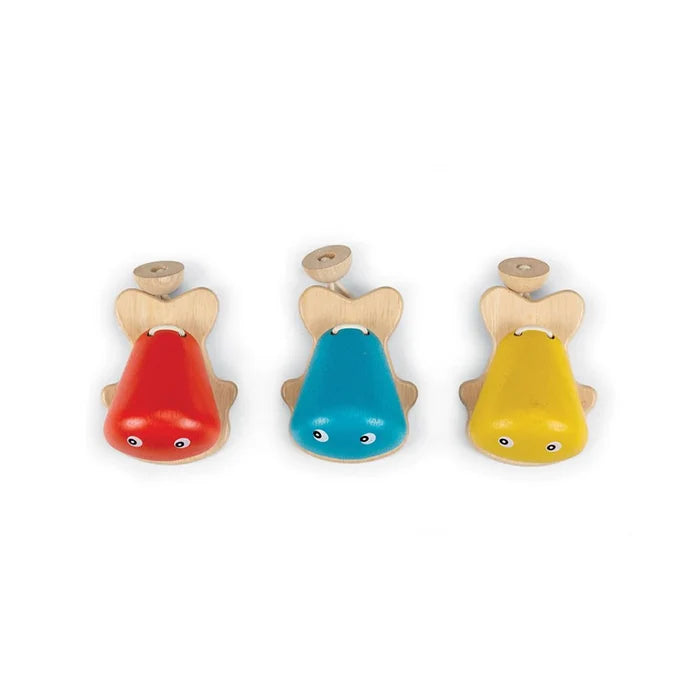Three colorful wooden fish castanet toys on a white background