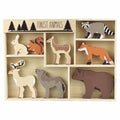 Wooden playset featuring various forest animal figures, including a deer, bear, and fox, displayed in a wooden box.