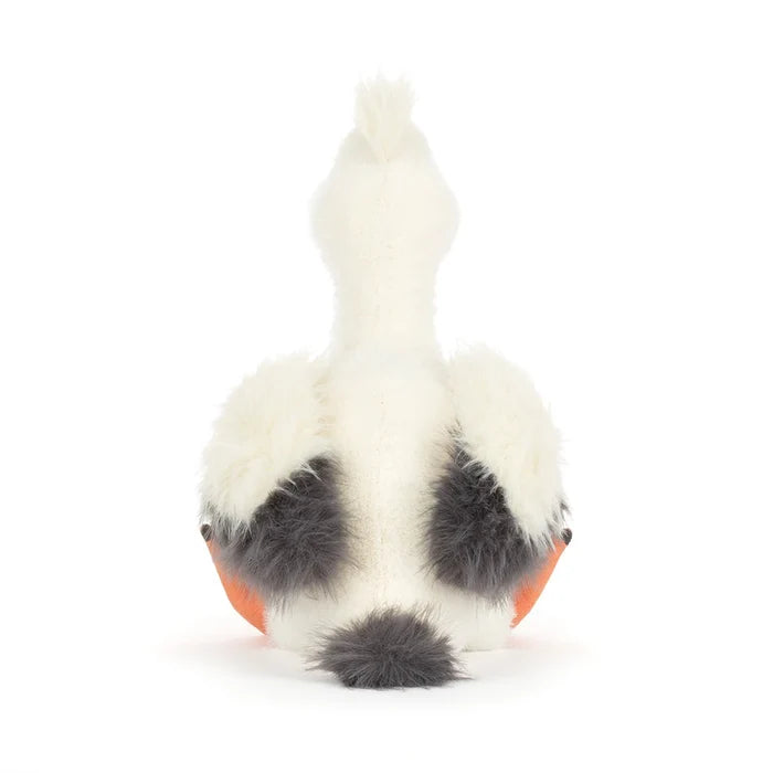 White plush toy with black spots on a white background