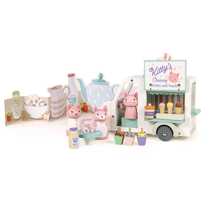 Toy set with pink animal figures and a ice cream cart on a white background