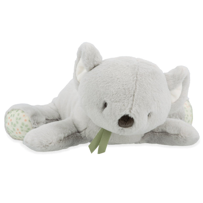 Grey koala soft toy laying on a white background