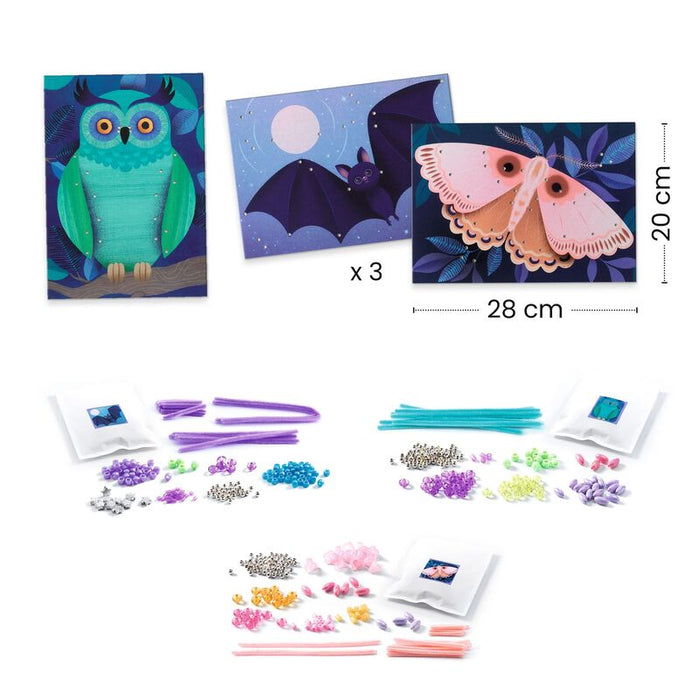 Craft kit with owl, bat, and moth decorations and craft materials on a white background.