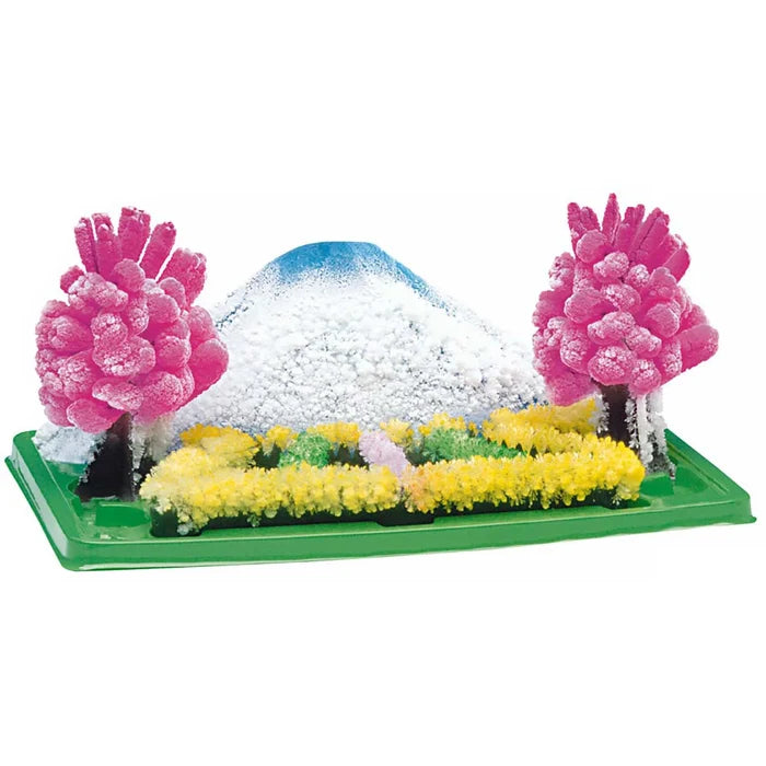Toy landscape with trees, snow, and a path on a white background