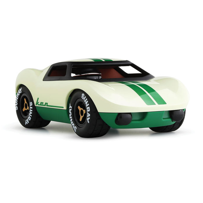 Toy car with green and white design on a white background