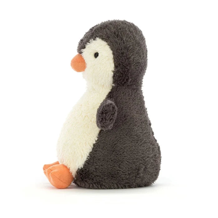 Stuffed penguin toy on a white background