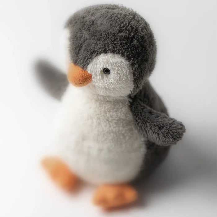 Plush toy penguin on a white background