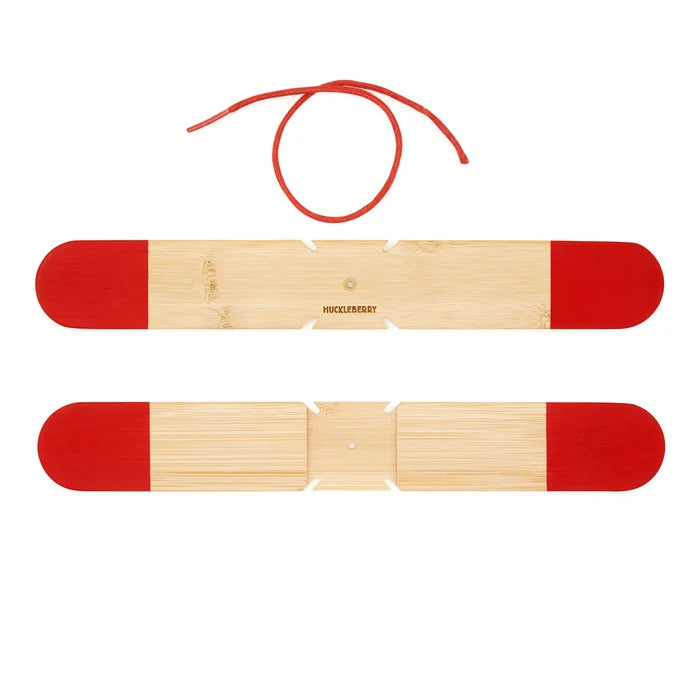Two boomerang natural wood pieces with red ends on a white background