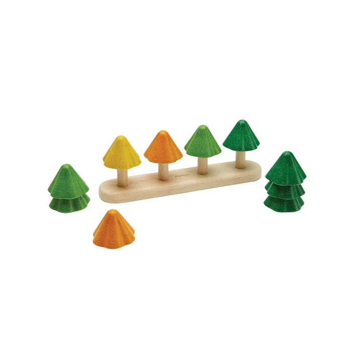 Set of colorful wooden trees on a white background