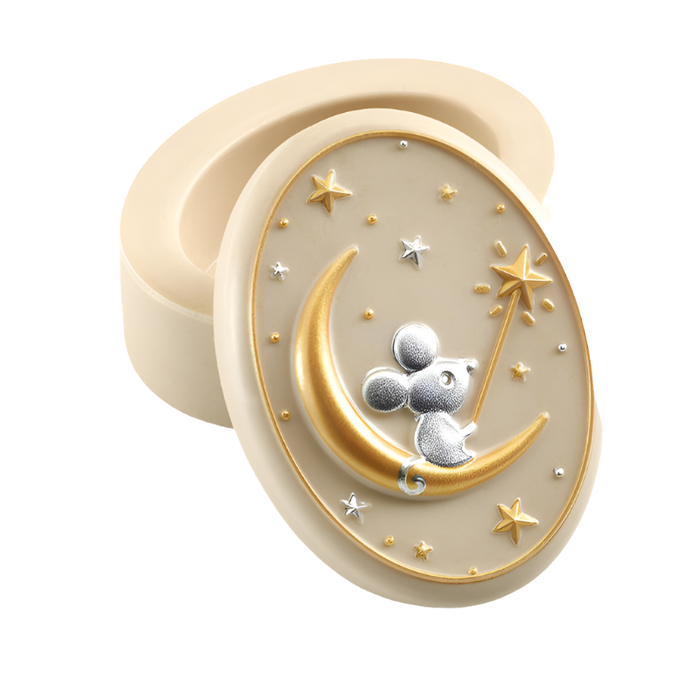 A small, oval-shaped beige resin tooth keeper box with a 3D illustration of a mouse on the moon design, surrounded by gold and silver stars.